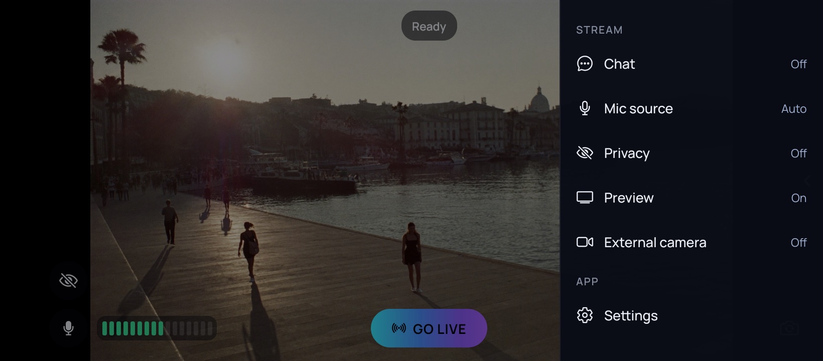 The camera screen held sideways with the menu open along the right: Chat, Mic source, Privacy, Preview and External camera under a Stream heading, and Settings under an App heading